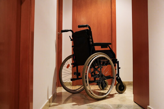 Empty wheelchair in home hallway
