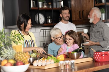 Multi-generational family together in the kitchen