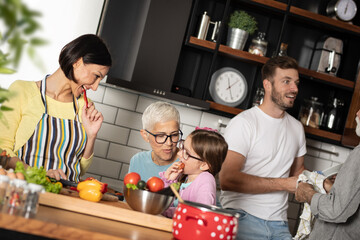 Three-generation family in kitchen