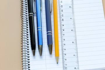 Ink pencils and a yellow lead pencil. Ruler and paper. Office concept.