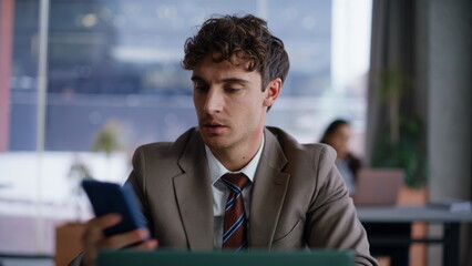 Office manager receive message with good news closeup. Man winning promotion