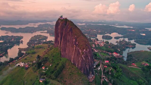 Aerial view of La Piedra del Pe&ntilde;ol monolith and lake at sunset &ndash; Guatap&eacute;, Medell&iacute;n, Colombia