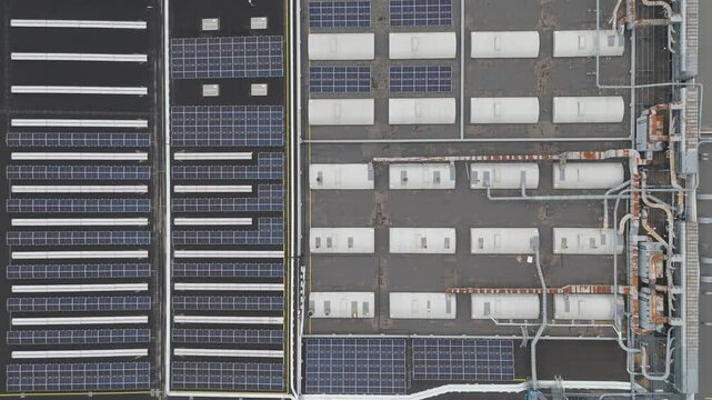 Roof of a modern furniture factory with solar panels from drone. Trnava, Slovakia