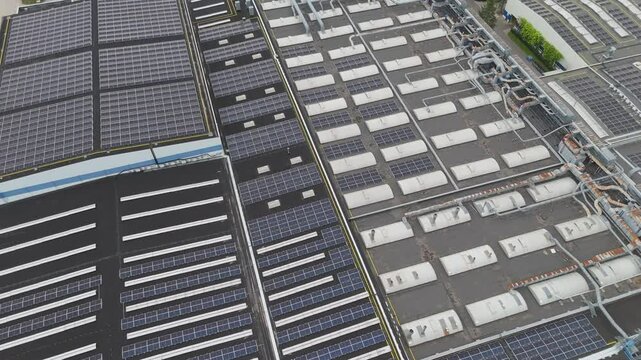 Roof of a modern furniture factory with solar panels from drone. Trnava, Slovakia