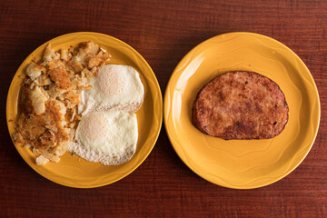 Two eggs, hash browns and ham