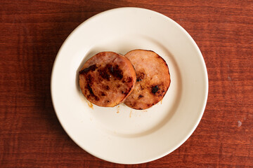 Canadian bacon on a plate