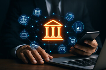 Person using phone and laptop with bank icon and connected digital interface overlaying the image