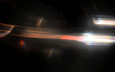 Light streaks with chromatic aberration dynamically cut across a dark background