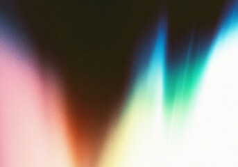 Abstract light shapes, displaying a grainy texture with blurred colorful edges