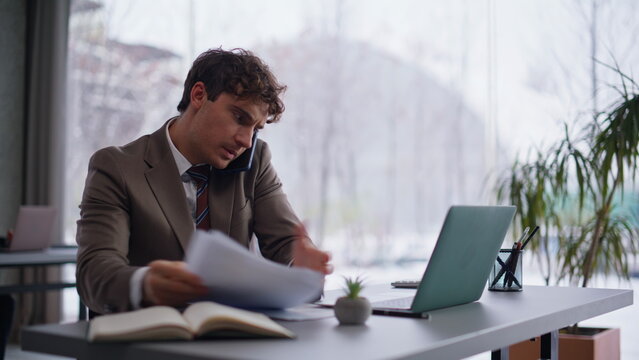 Calling businessman feeling nervous discussing document mistake office closeup