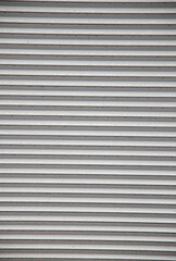 Gray surface with deep horizontal lines and depressions