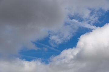 The sky is cloudy and the sun is shining through the clouds
