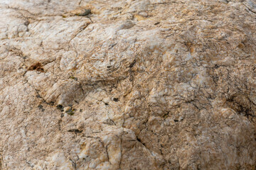 The rock is rough and has a lot of texture