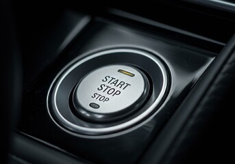 Close-up of a modern car's "Start Stop" engine button on the dashboard, emphasizing advanced keyless technology and convenient vehicle controls.