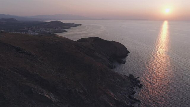 A drone flight across the rough and dry coast line at the north of Crete island close to the city of Heraklion 