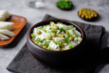 Cabbage cucumber green peas mayonnaise salad in a bowl