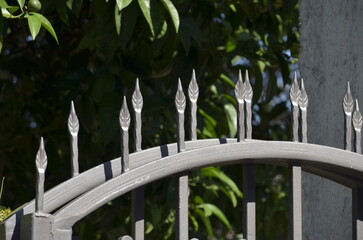 Arrows on top of metal fence