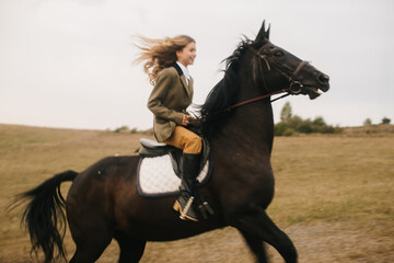 Woman Riding Horse Across Open Field on a Windy Day