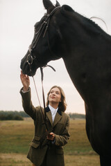 Elegant Woman Interacting With a Graceful Horse in a Scenic Countryside