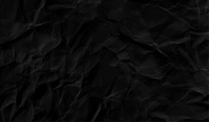 crumpled black paper texture background.  From above black crumpled paper texture. Black crumpled background.