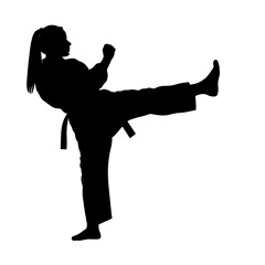 Silhouette of a woman practicing karate kick without background  