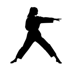 Female silhouette performing martial arts stance without background  