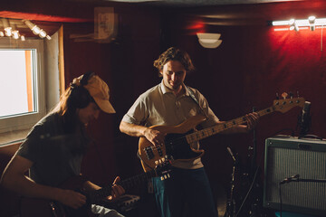 Musicians playing guitars in recording studio