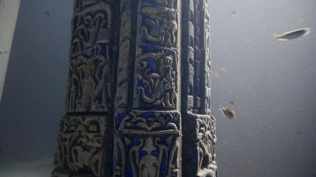 interior scenes of abandoned ruins underwater, walls and pillars made of lapis lazuli, crumbling scenes, dim light