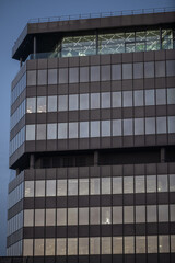 Modern glass office building with reflective windows in Cologne.