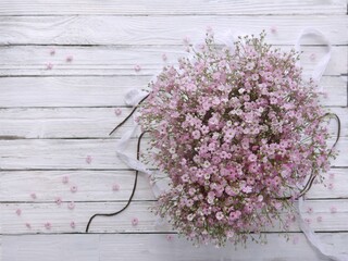 lilac flowers on a wooden background