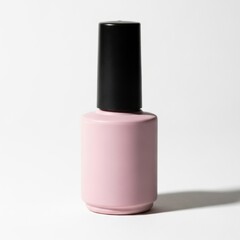 Obraz premium Minimalist pink nail polish bottle on a white background