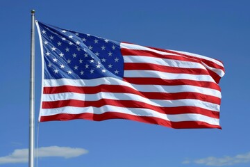 Fototapeta premium American flag waving against clear blue sky