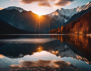 A breathtaking sunset scene featuring snow-capped mountains in the background.