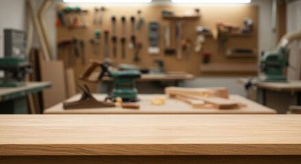 A blurred woodworking shop interior with tools hanging on the wall and a wooden table in the foreground
