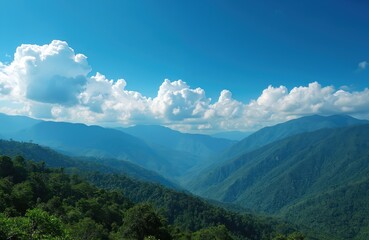 Obraz premium Panoramic view of Colombian mountains under blue sky. Lush green forest covers the mountainsides. White fluffy clouds float above. Stunning nature landscape for travel tours, vacation, exploration.