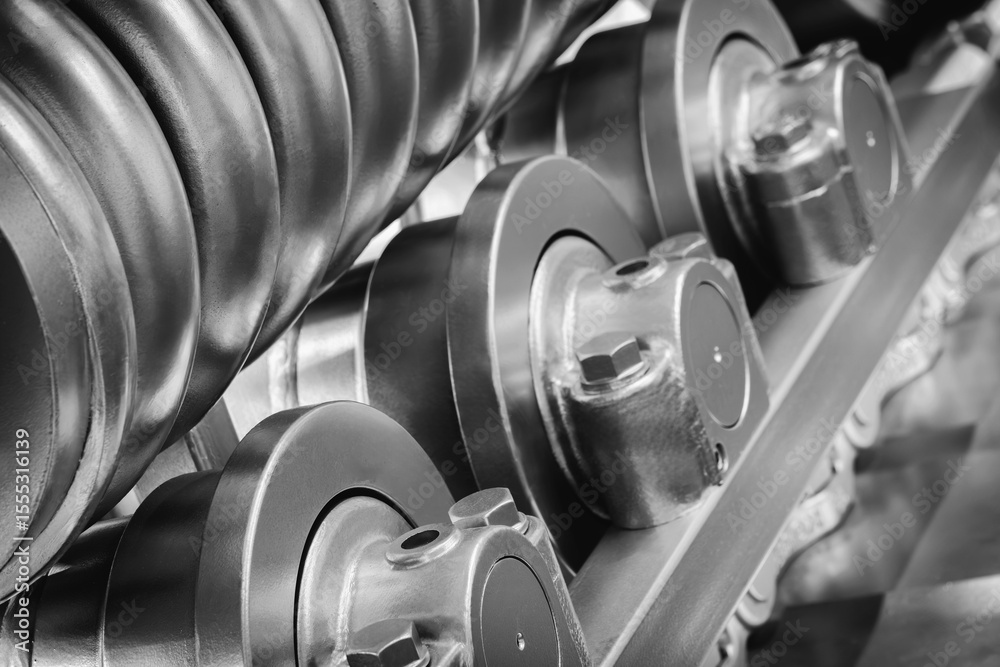 Aufkleber track Tractor on roller close up machine part many bolts and screws сoncept complexity precision, many parts fasteners work together create functioning machine