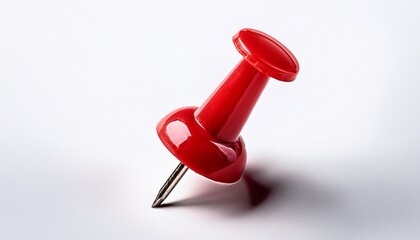close up of a bright red pushpin on white background