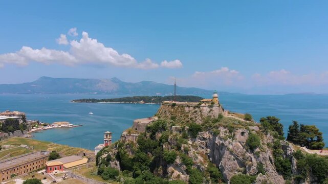Aerial footage showcasing the majestic Old Fortress of Corfu, a historic Venetian citadel perched on a rocky peninsula overlooking the Ionian Sea