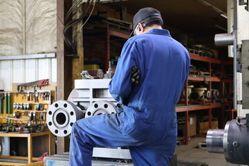 industrial worker operating a machine
