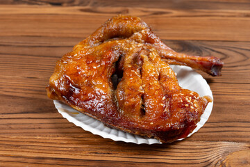angle view honey-glazed roast duck leg at horizontal composition