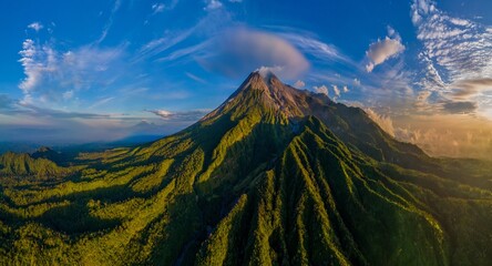 Naklejka premium Epic drone shot of active volcano view at sunrise. Morning panorama scenery of Merapi volcano