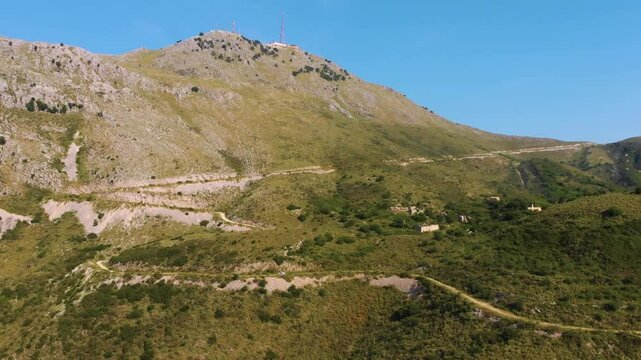 Aerial footage showcasing the majestic Mount Pantokrator, the highest peak on Corfu Island, Greece.