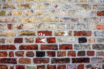 Colorful brick wall showing different shades and textures creating a vintage background