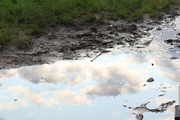 sky reflection on a puddle