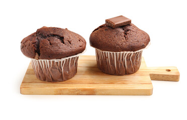 Wooden board with tasty chocolate cupcakes isolated on white background