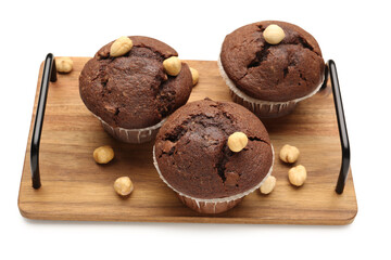 Wooden board with tasty chocolate cupcakes isolated on white background
