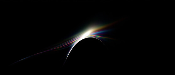 Light trails bending in a colorful arc on black background