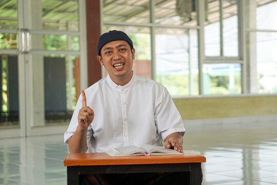 Asian moslem man smile at mosque show faith believe to god. Religion, islamic photo concept
