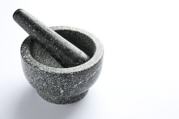 Stone mortar and pestle on white background, space for text