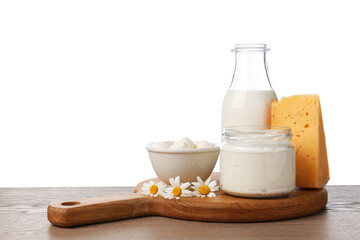 Different fresh dairy products and chamomile flowers on wooden table against white background